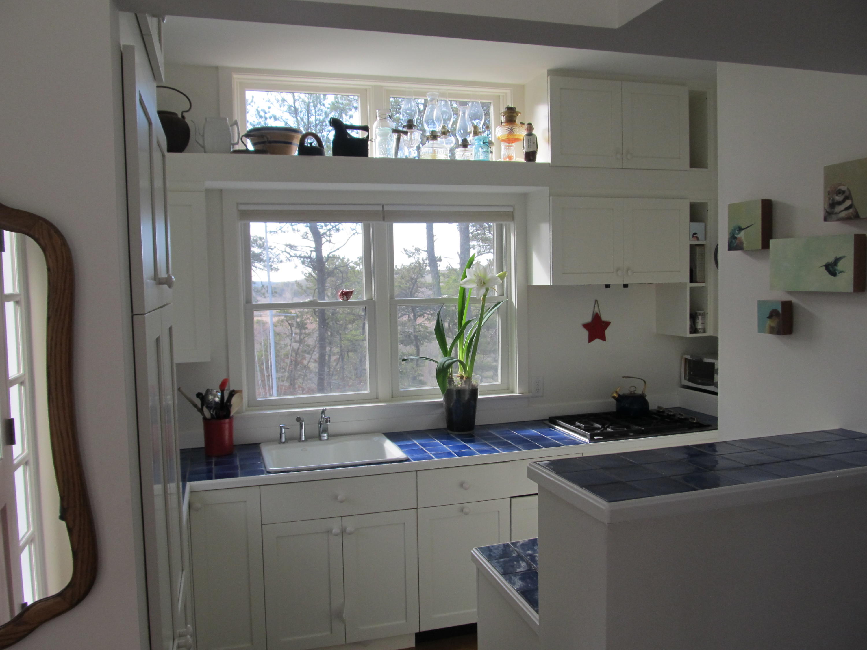 1000 Old County Road Wellfleet, MA 02667 - Photo 12 of 35 a kitchen with a sink and large windows