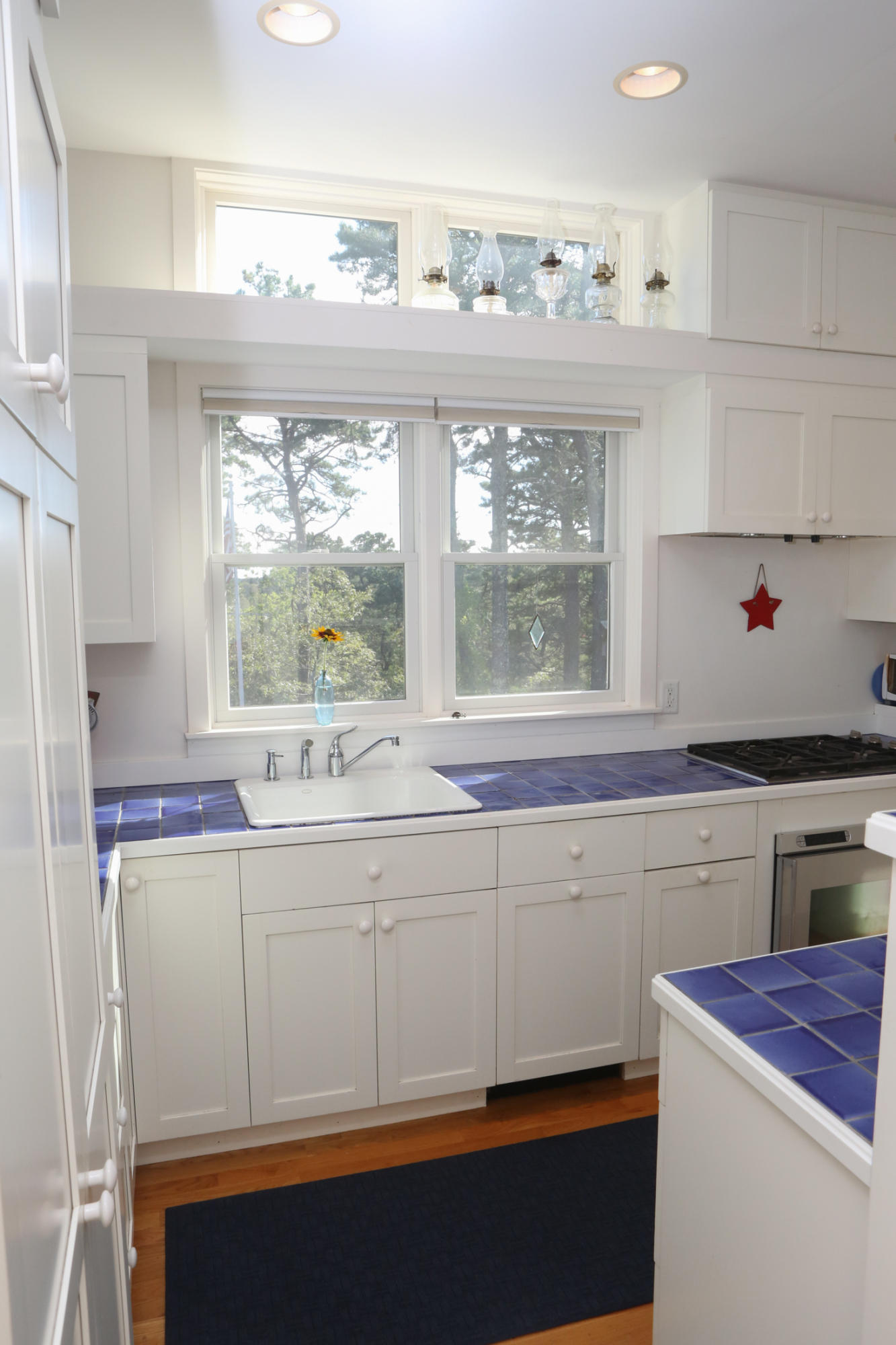1000 Old County Road Wellfleet, MA 02667 - Photo 13 of 35 a kitchen with a sink stove and cabinets