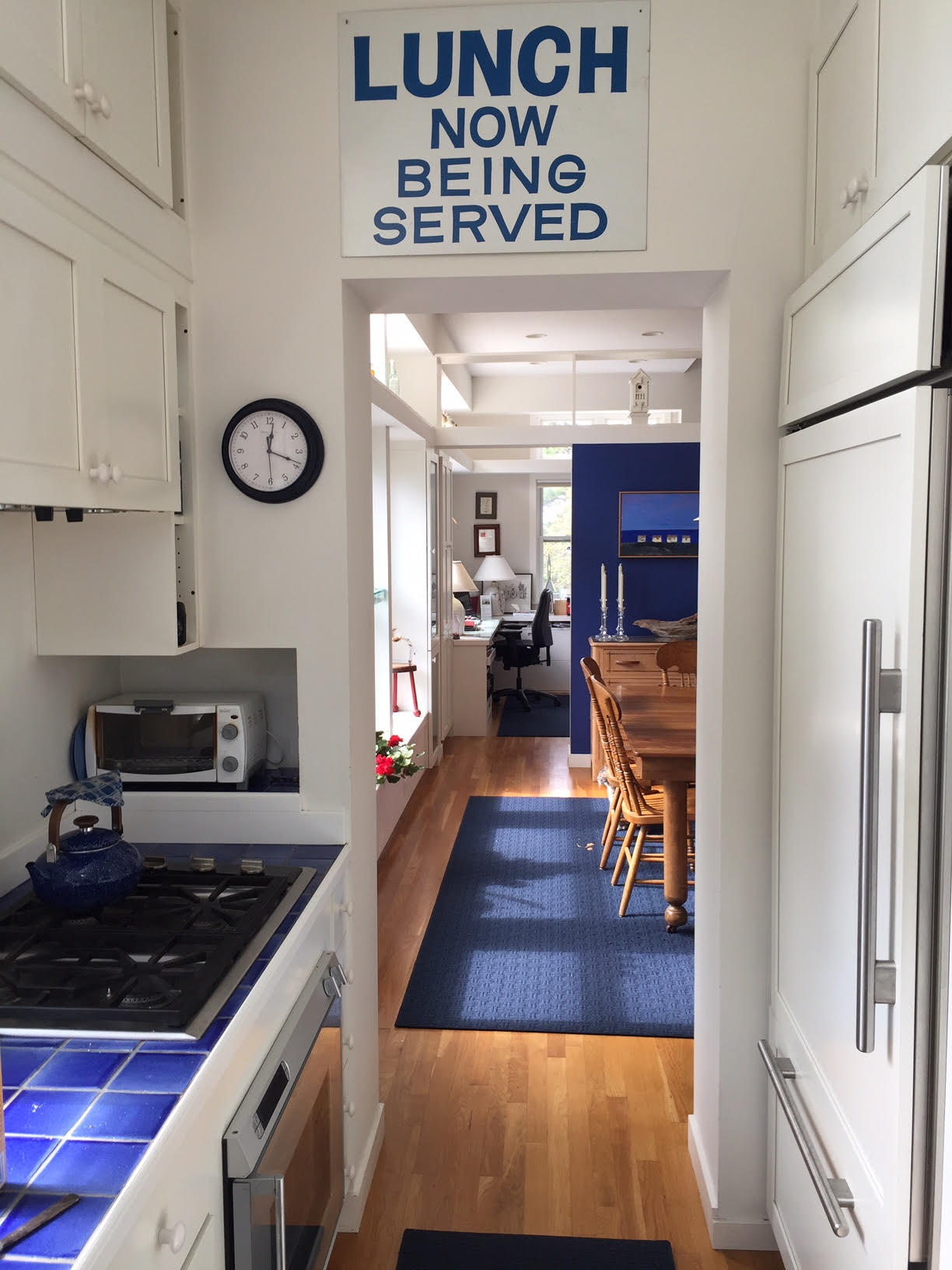 1000 Old County Road Wellfleet, MA 02667 - Photo 14 of 35 a kitchen with stainless steel appliances granite countertop a stove a refrigerator and a dining table with wooden floors