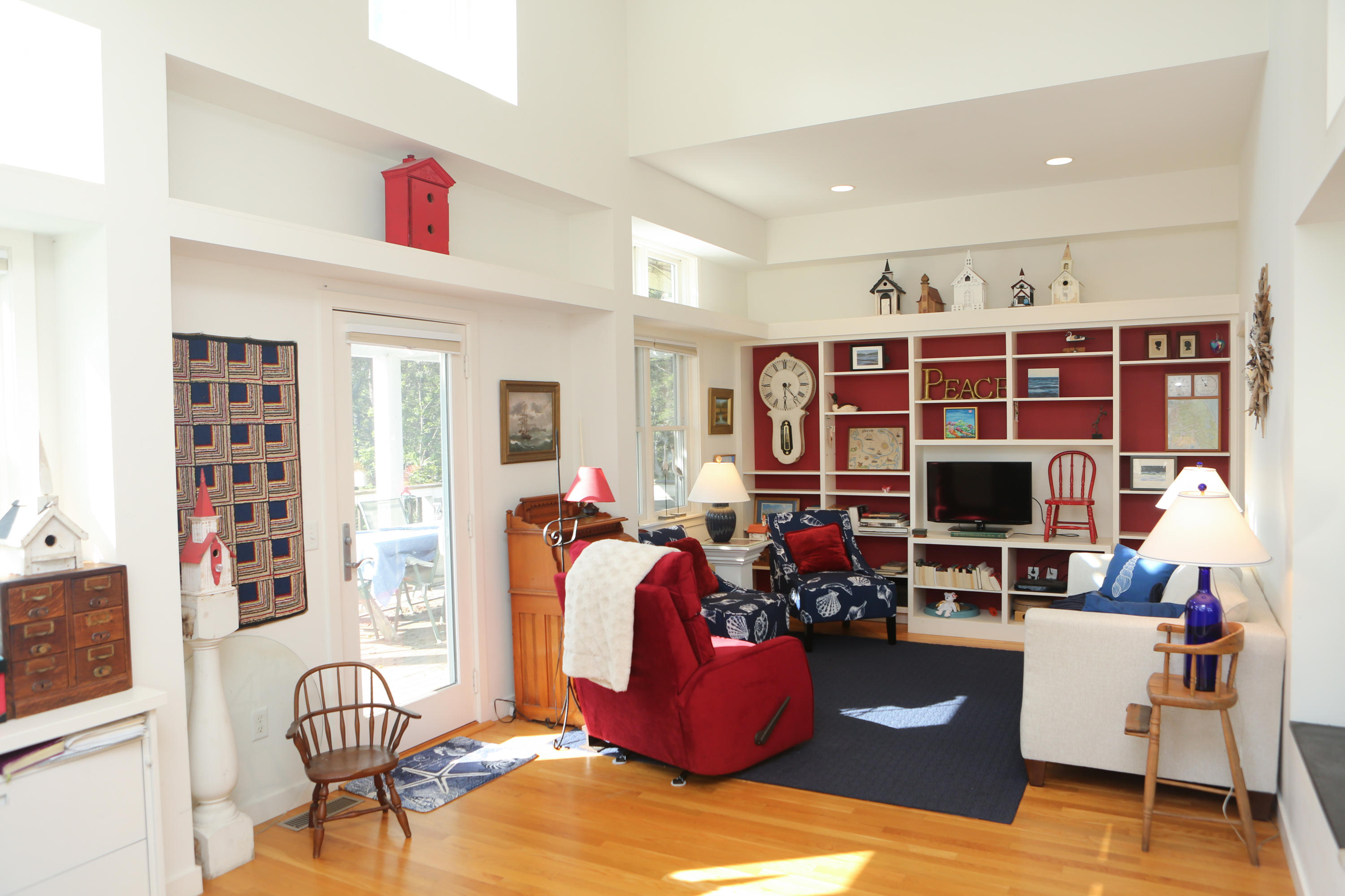1000 Old County Road Wellfleet, MA 02667 - Photo 20 of 35 a living room with furniture a fireplace and a flat screen tv