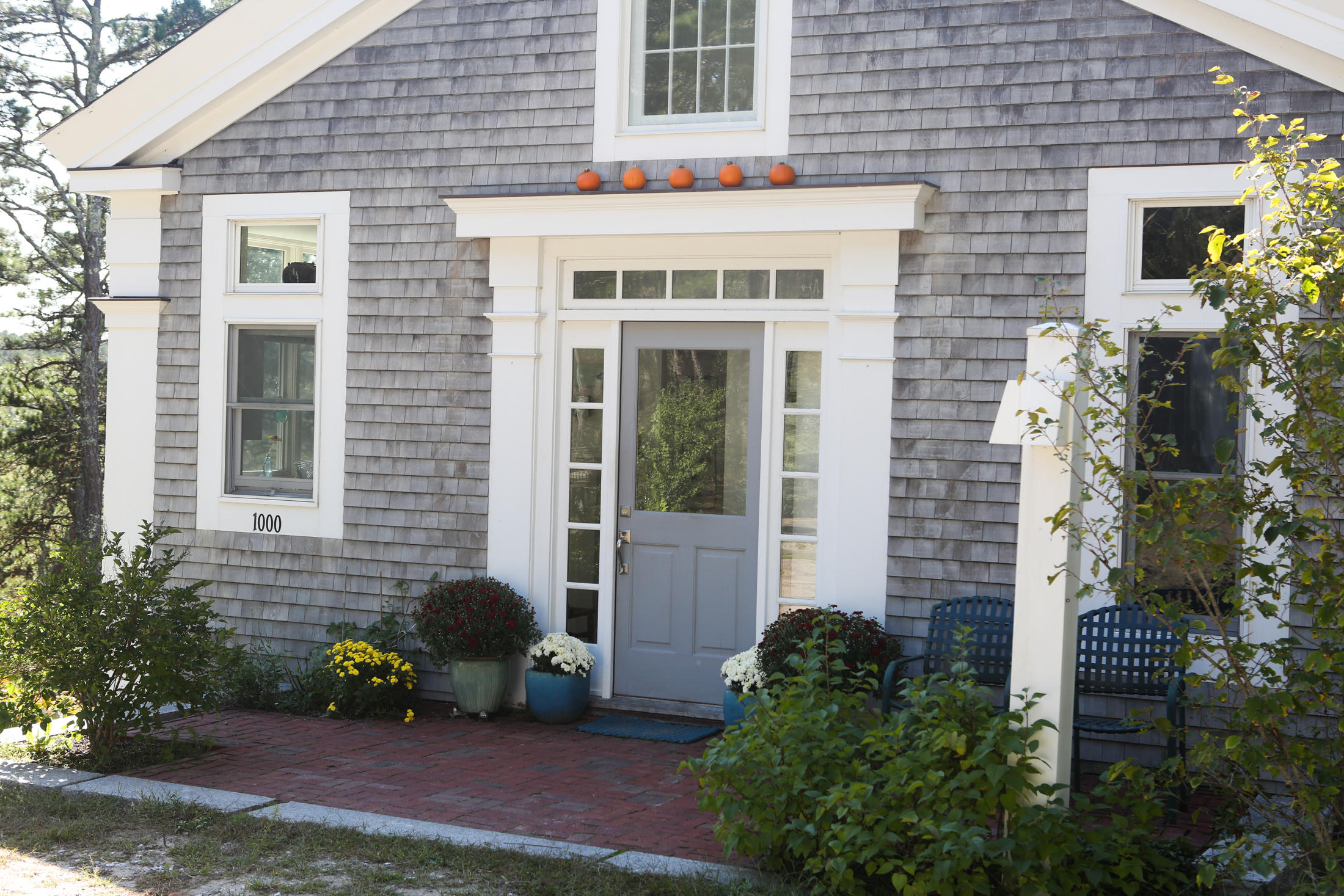 1000 Old County Road Wellfleet, MA 02667 - Photo 2 of 35 a front view of a house with a yard