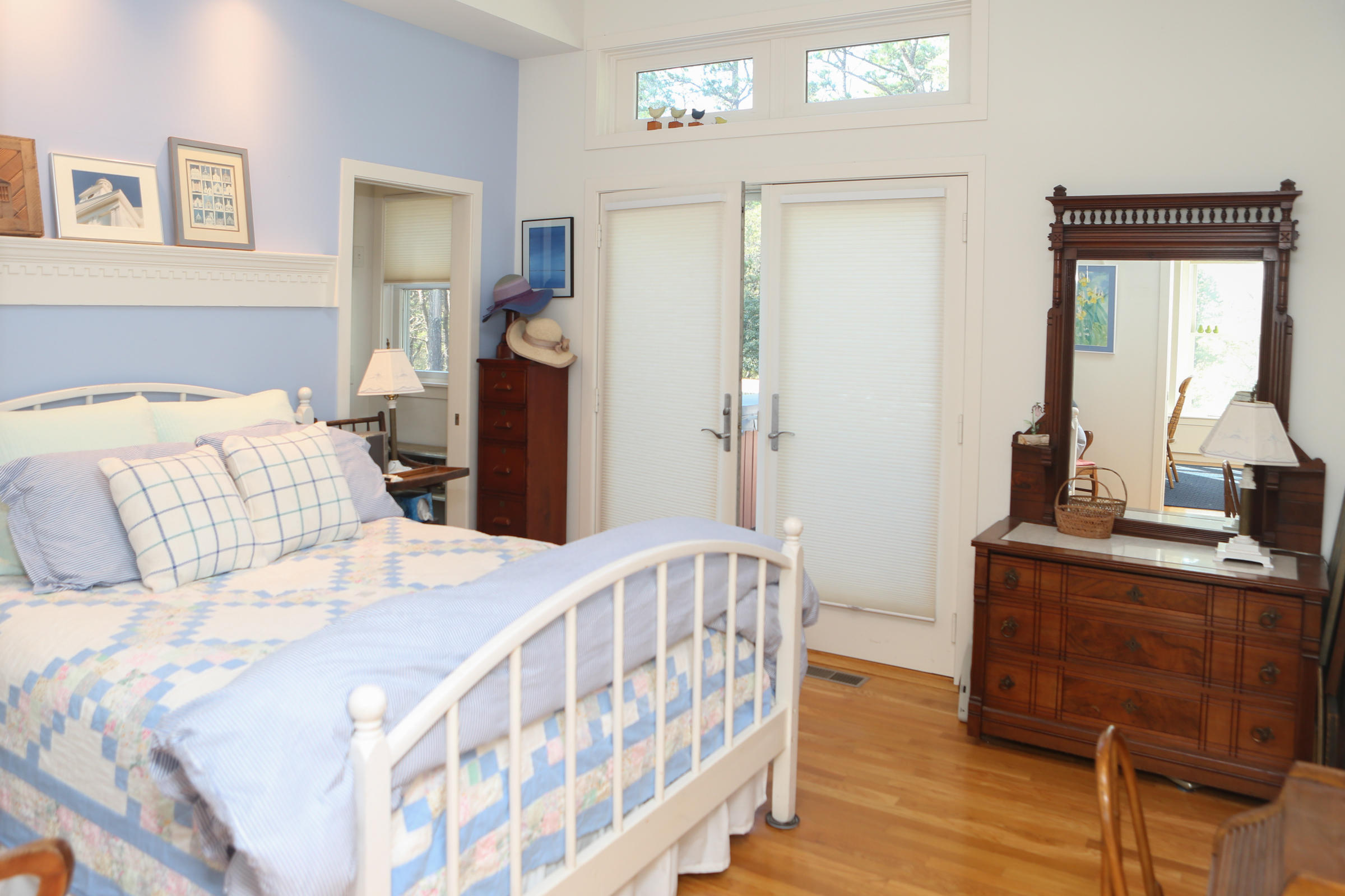 1000 Old County Road Wellfleet, MA 02667 - Photo 23 of 35 a bedroom with a bed and a table in it