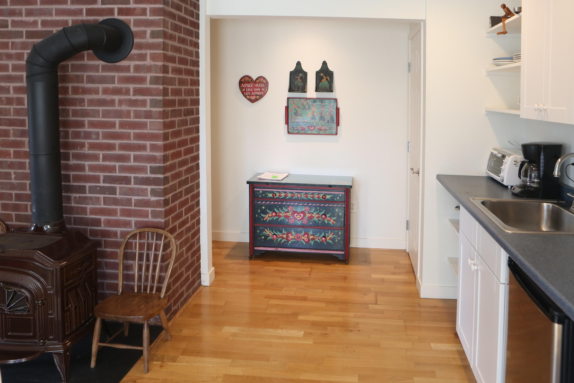 1000 Old County Road Wellfleet, MA 02667 - Photo 28 of 35 a hallway with a kitchen stove and a microwave