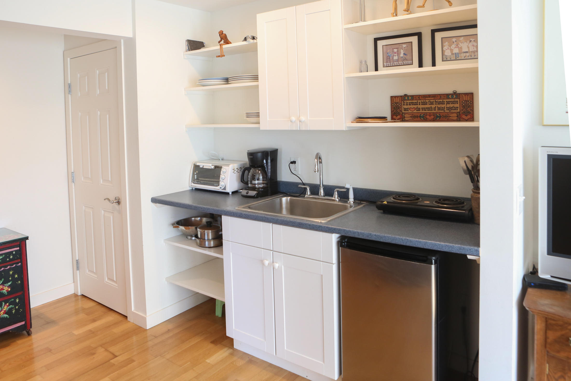 1000 Old County Road Wellfleet, MA 02667 - Photo 29 of 35 a kitchen with a sink and cabinets