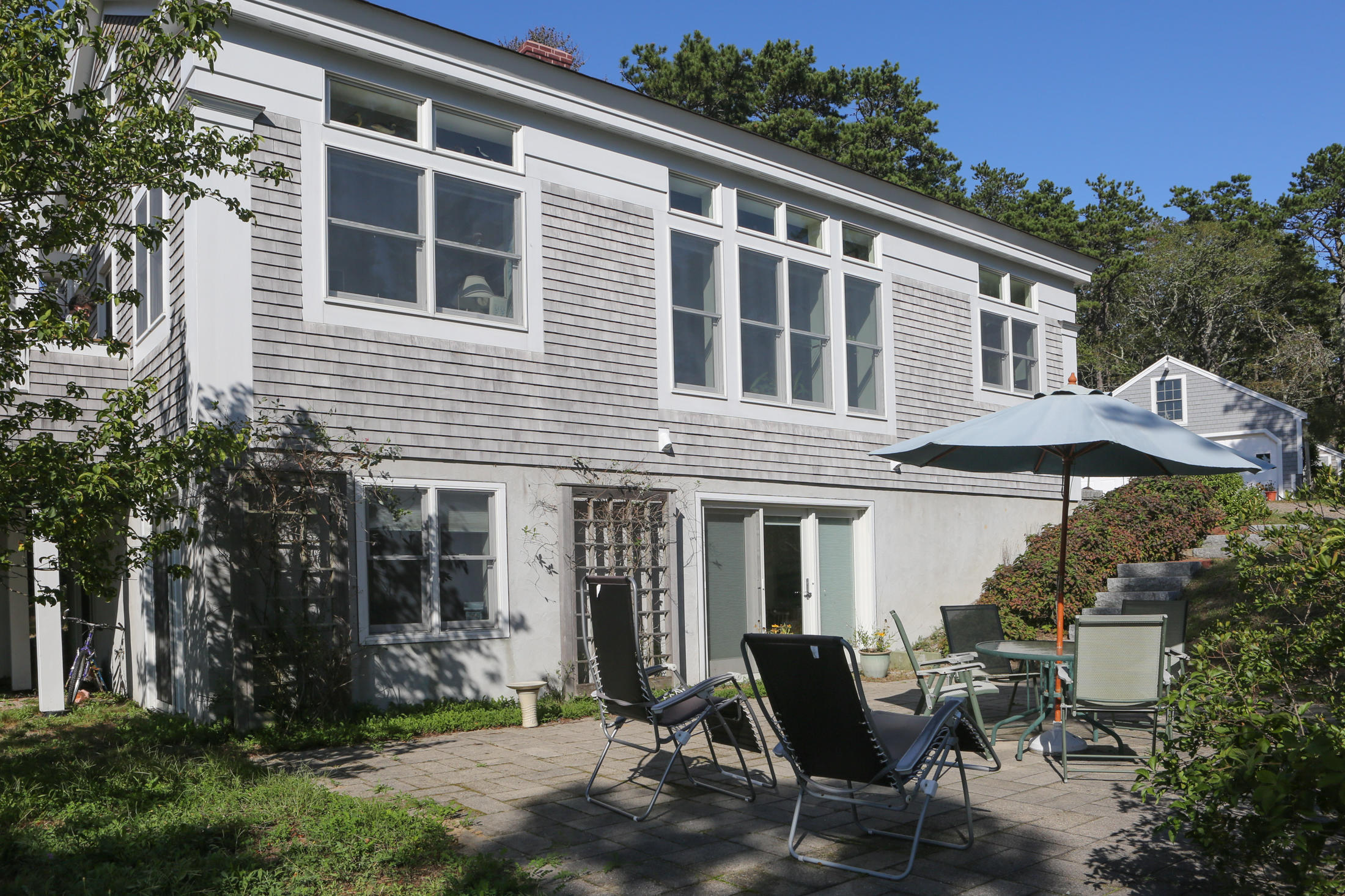 1000 Old County Road Wellfleet, MA 02667 - Photo 3 of 35 a front view of house with outdoor seating and yard
