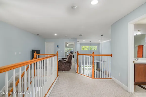 a bathroom with a sink a toilet a mirror and vanity