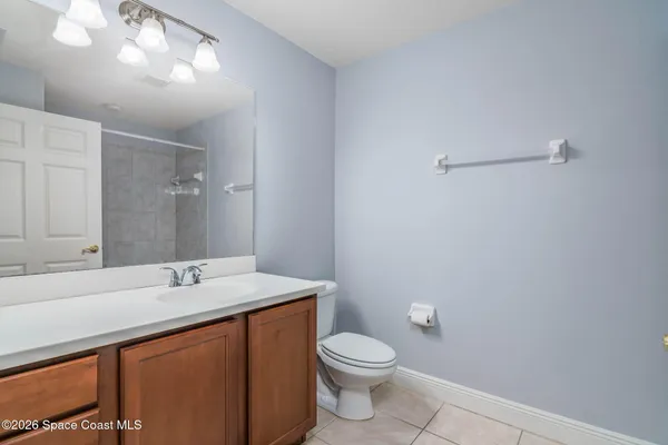 a bathroom with a sink a mirror and vanity