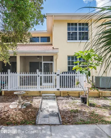 front view of a brick house with a large windows