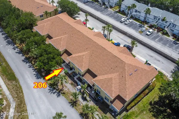 an aerial view of a residential building and lake view