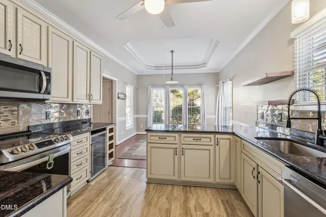 a kitchen with a sink stove top oven and microwave