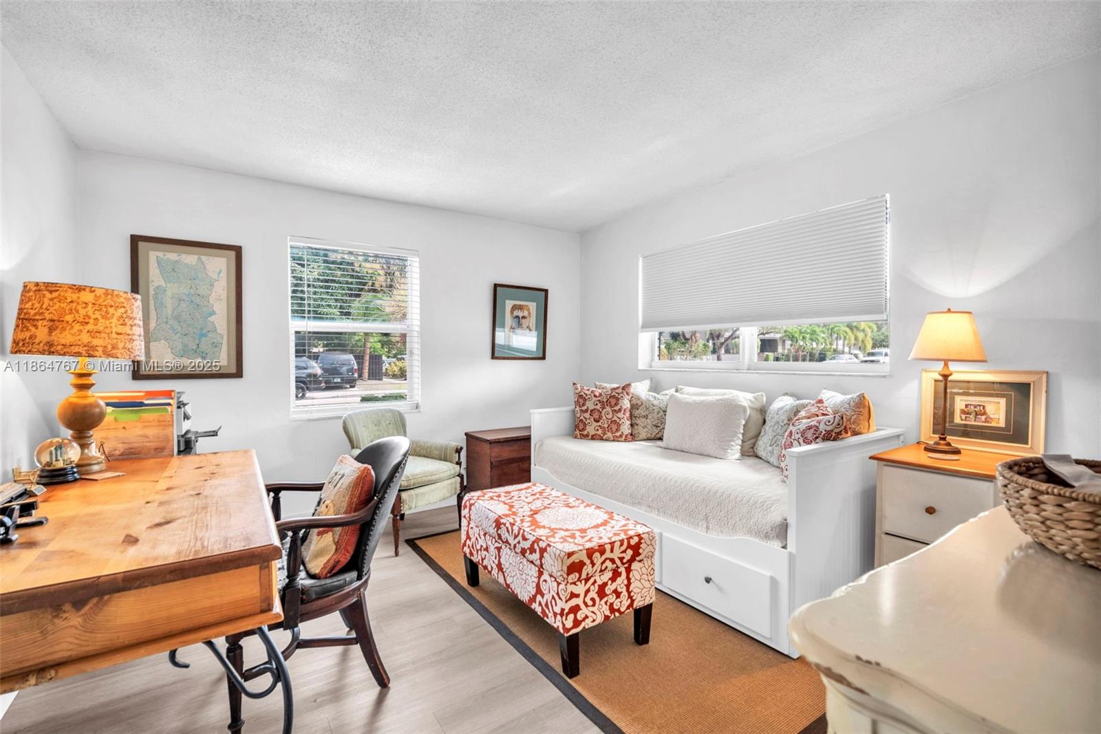 1280 Southeast 2nd Court, Unit 1 Fort Lauderdale, FL 33301 - Photo 16 of 34 a living room with furniture and a flat screen tv