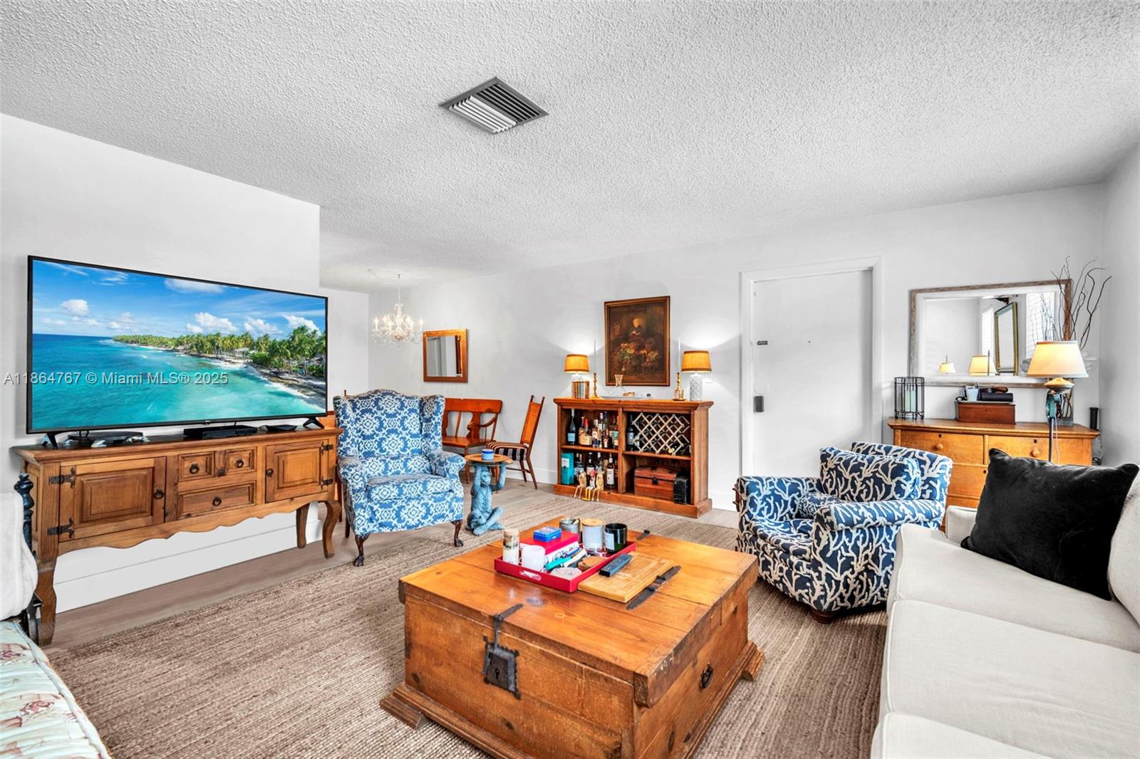 1280 Southeast 2nd Court, Unit 1 Fort Lauderdale, FL 33301 - Photo 5 of 34 a living room with furniture and a flat screen tv