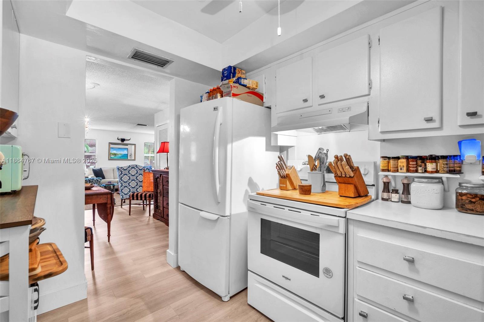 1280 Southeast 2nd Court, Unit 1 Fort Lauderdale, FL 33301 - Photo 10 of 34 a kitchen with stainless steel appliances granite countertop a refrigerator and a stove top oven