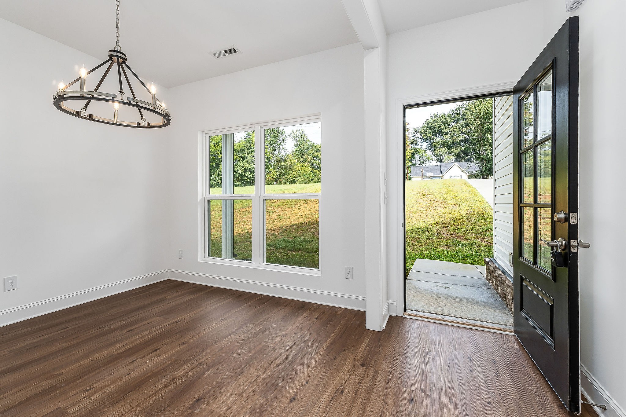 431 Old Morrison Road McMinnville, TN 37110 - Photo 14 of 45 a view of an empty room with wooden floor and a window