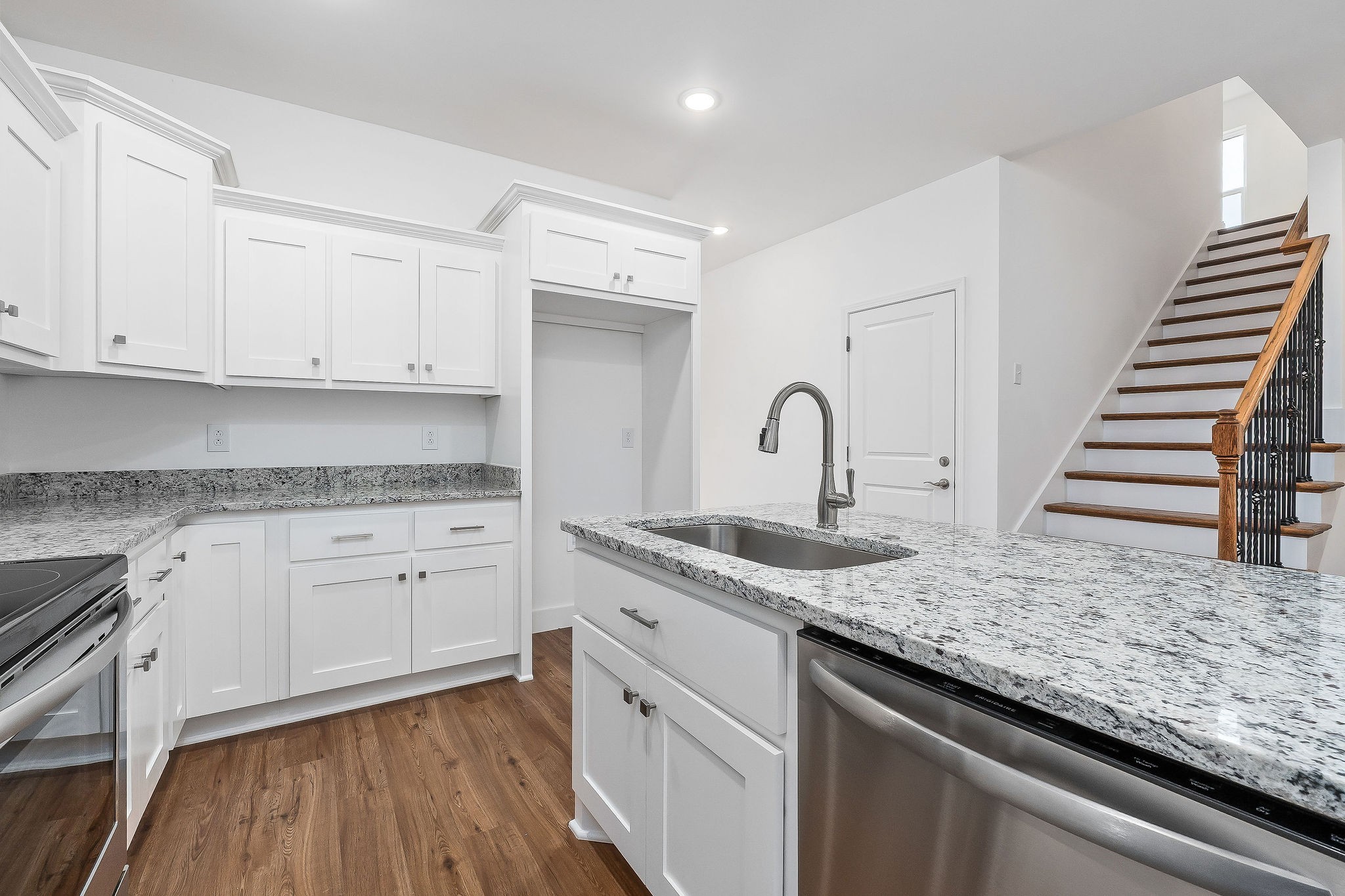 431 Old Morrison Road McMinnville, TN 37110 - Photo 19 of 45 a kitchen with granite countertop white cabinets and a sink