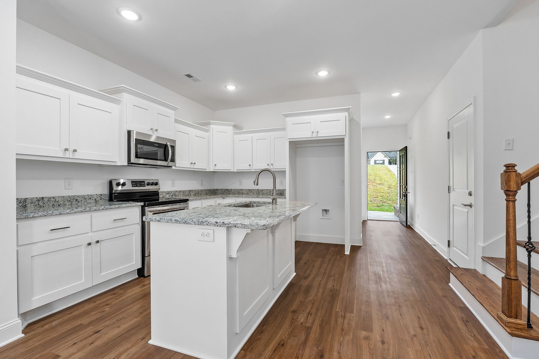 431 Old Morrison Road McMinnville, TN 37110 - Photo 20 of 45 a kitchen with granite countertop a sink cabinets and wooden floor