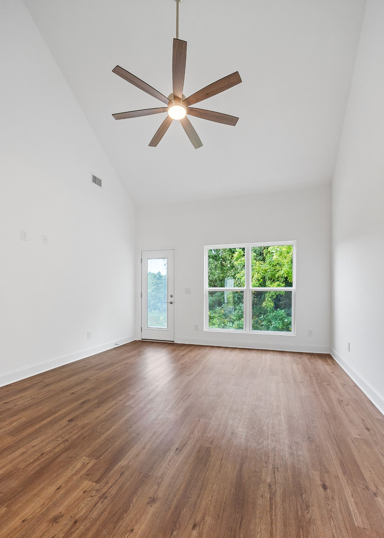 431 Old Morrison Road McMinnville, TN 37110 - Photo 22 of 45 an empty room with wooden floor fan and windows