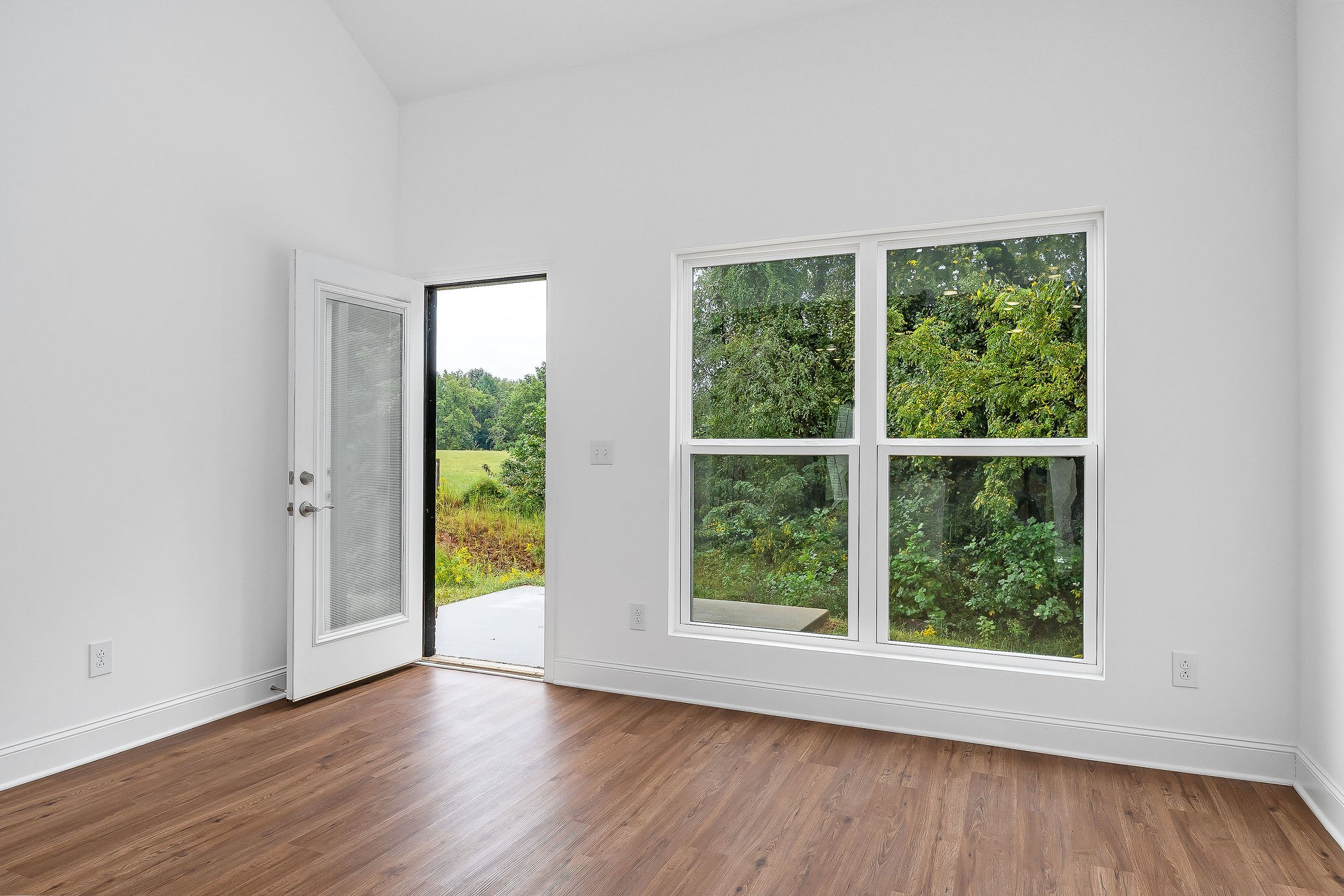 431 Old Morrison Road McMinnville, TN 37110 - Photo 24 of 45 a view of a big room with wooden floor and windows