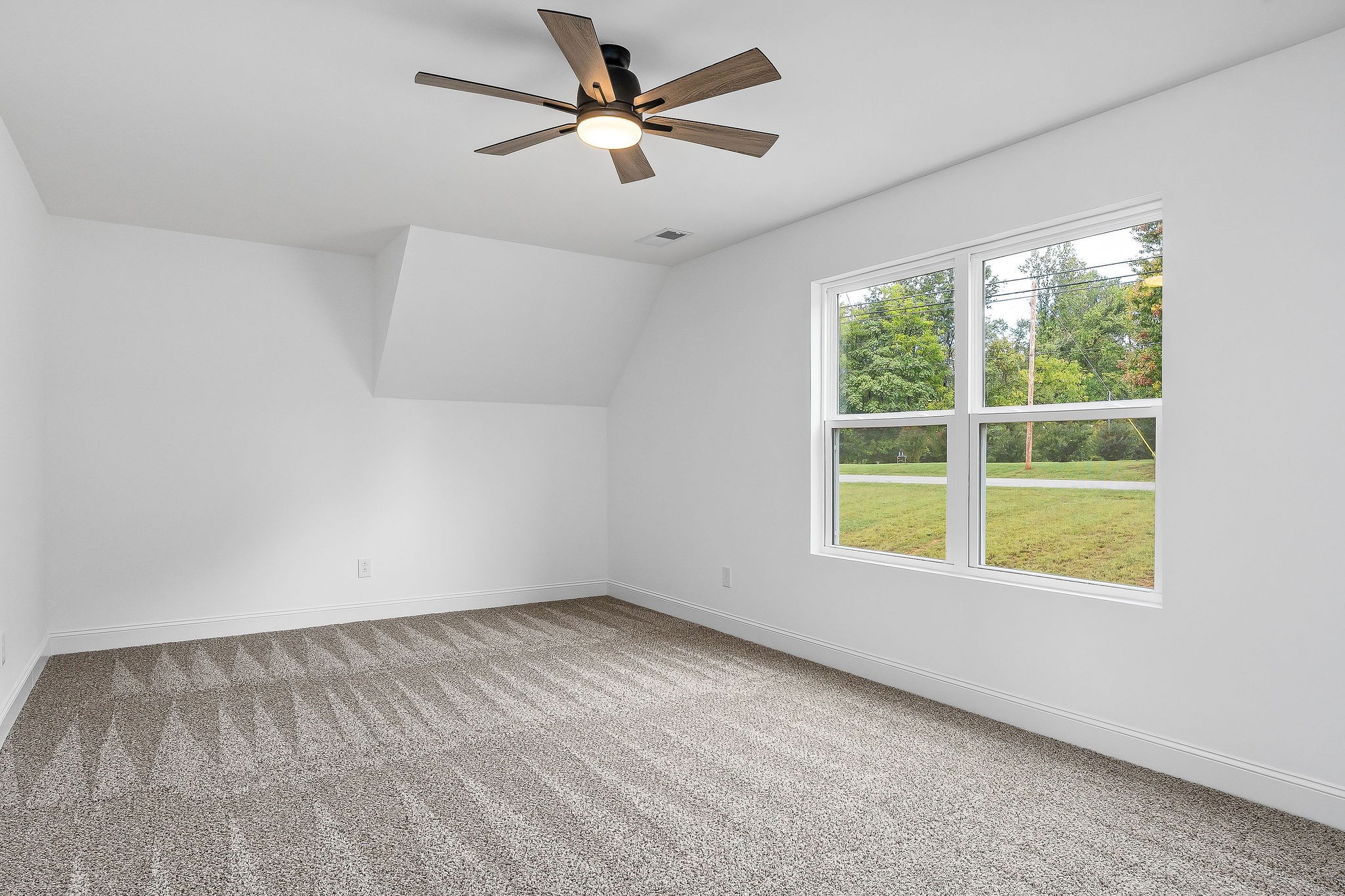 431 Old Morrison Road McMinnville, TN 37110 - Photo 31 of 45 an empty room with a window and a fan