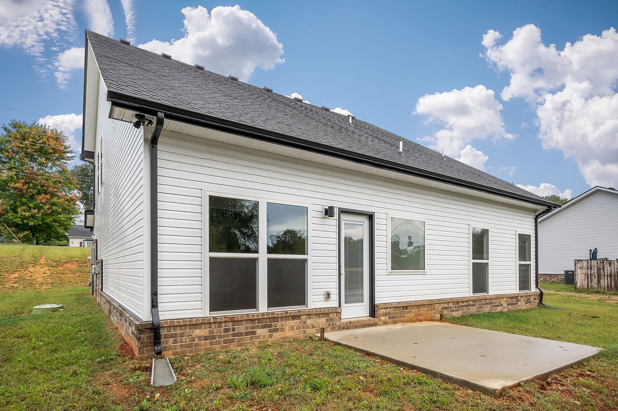 431 Old Morrison Road McMinnville, TN 37110 - Photo 7 of 45 a view of a white house with a yard potted plants and a table