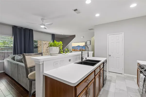 a kitchen that has a stove and a table