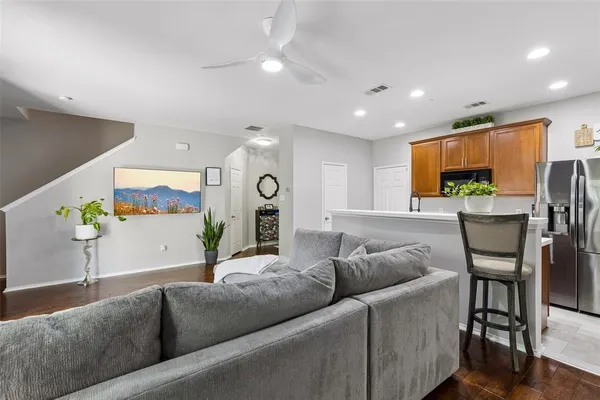 a living room with furniture and a large window