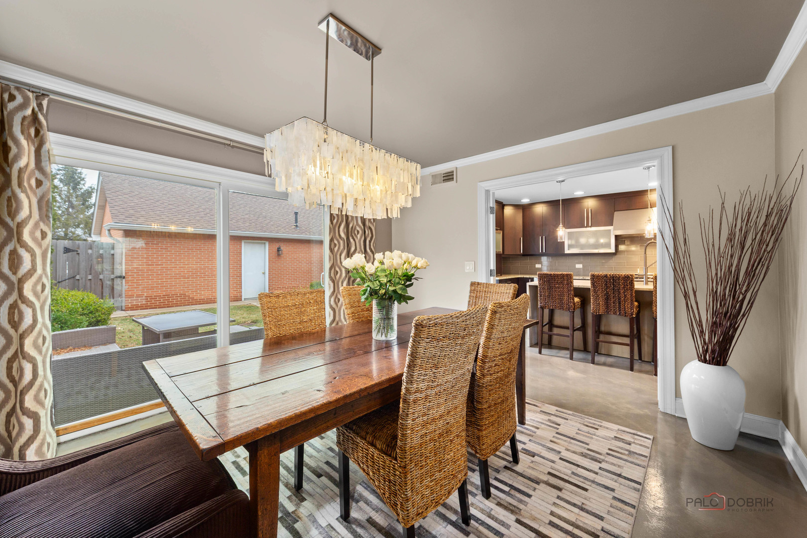 2 North Tower Road Oak Brook, IL 60523 - Photo 15 of 40 a dining room with furniture a chandelier and wooden floor