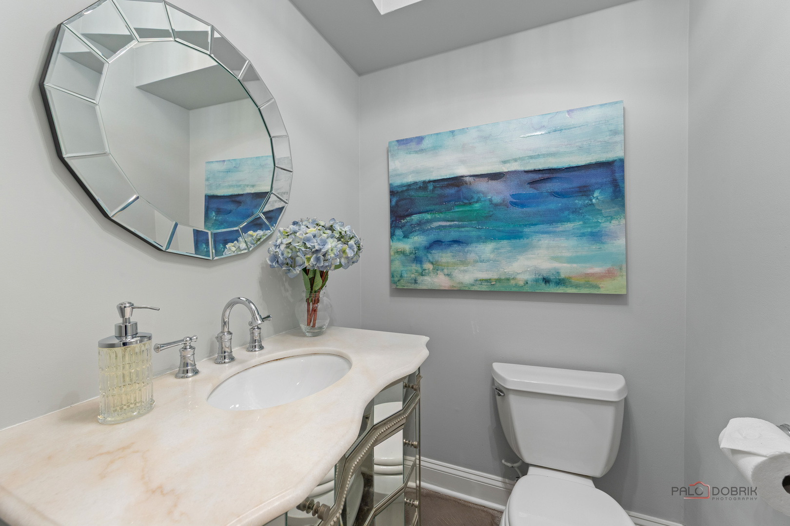 2 North Tower Road Oak Brook, IL 60523 - Photo 19 of 40 a bathroom with a toilet a sink and a mirror
