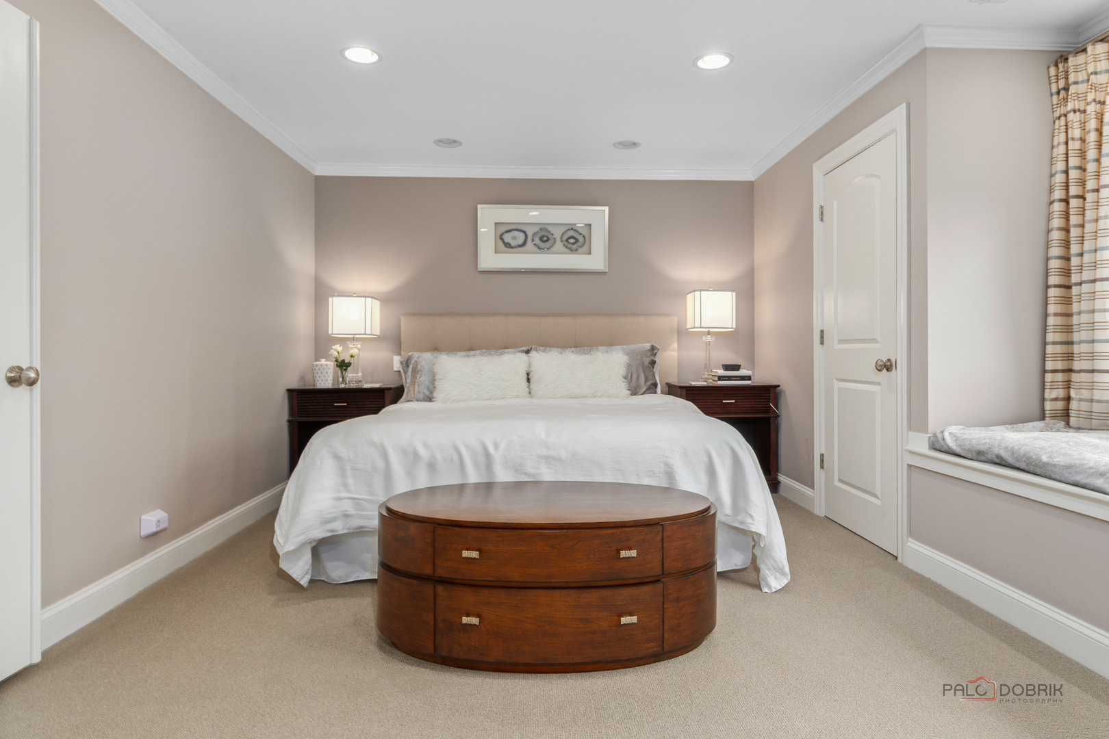 2 North Tower Road Oak Brook, IL 60523 - Photo 25 of 40 a spacious bedroom with a bed and a couch