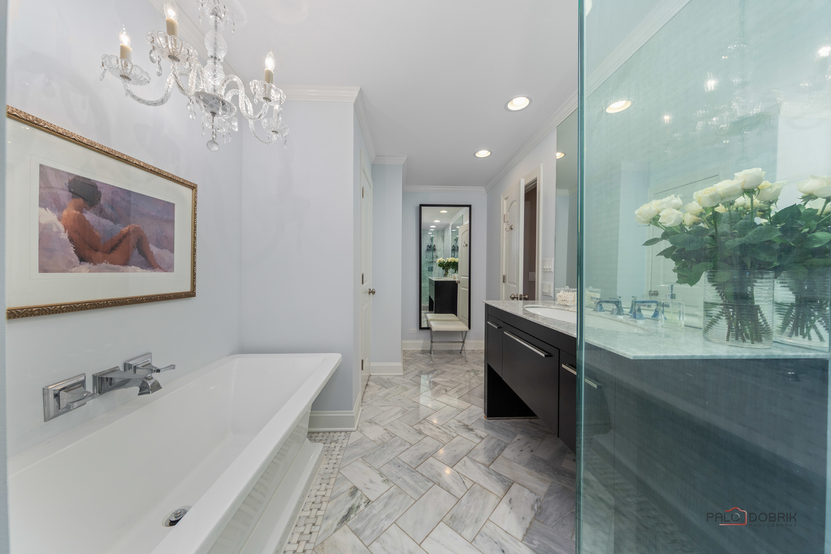 2 North Tower Road Oak Brook, IL 60523 - Photo 27 of 40 a spacious bathroom with a tub sink and a mirror