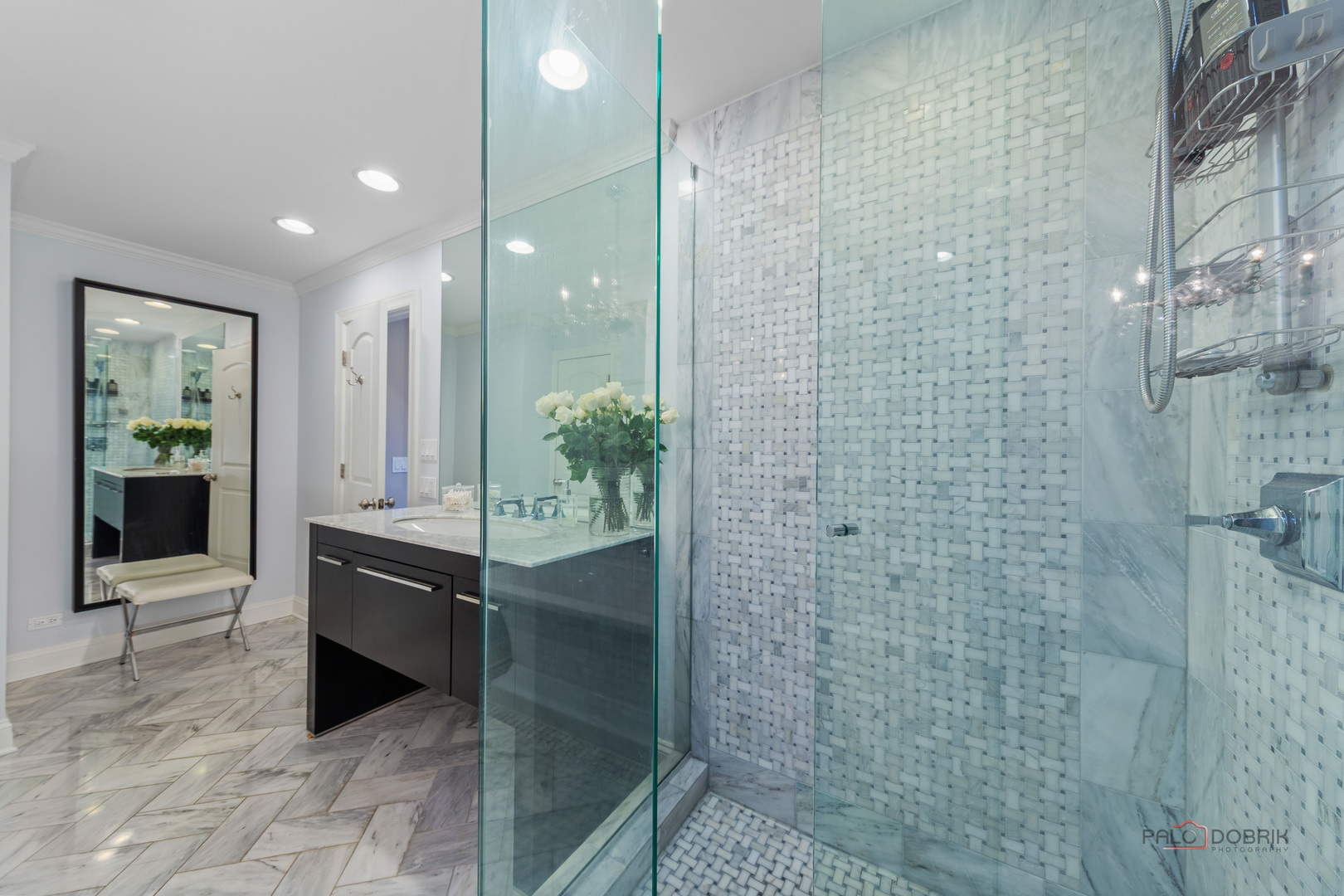 2 North Tower Road Oak Brook, IL 60523 - Photo 28 of 40 a bathroom with a granite countertop shower a mirror and a sink