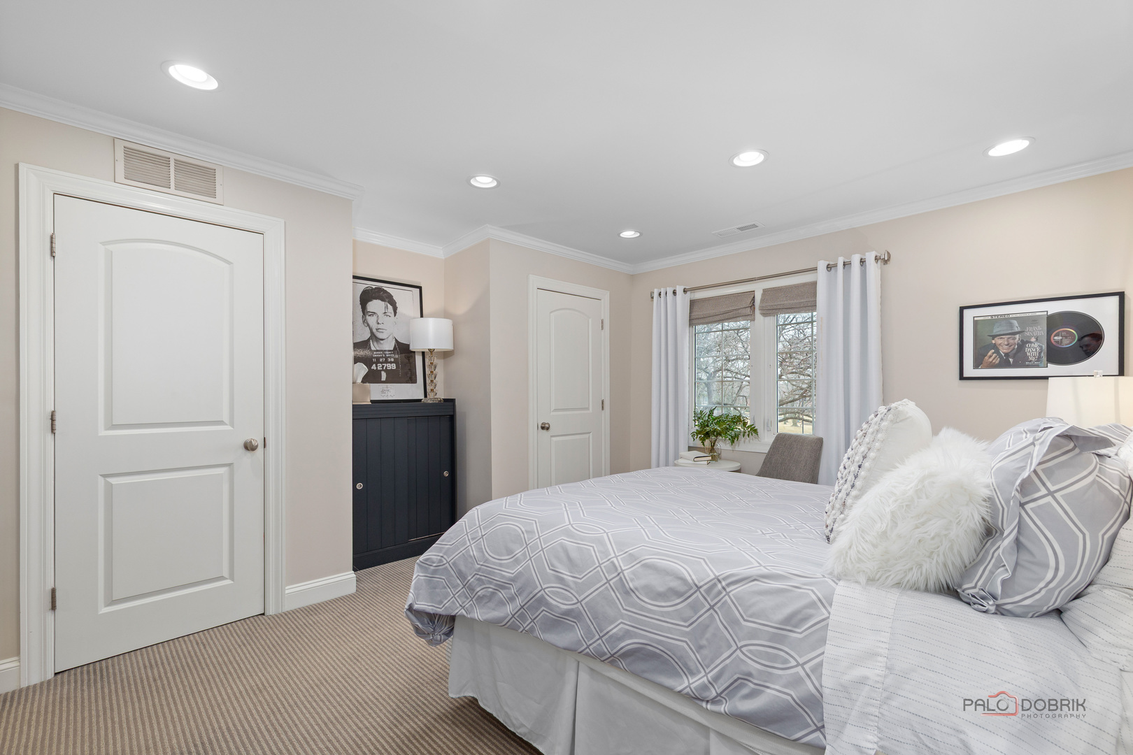 2 North Tower Road Oak Brook, IL 60523 - Photo 31 of 40 a bedroom with a bed and a painting