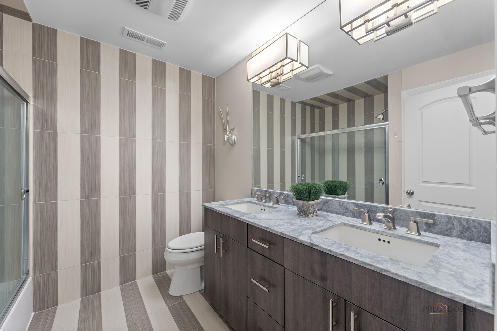 2 North Tower Road Oak Brook, IL 60523 - Photo 32 of 40 a bathroom with a double vanity sink mirror and toilet