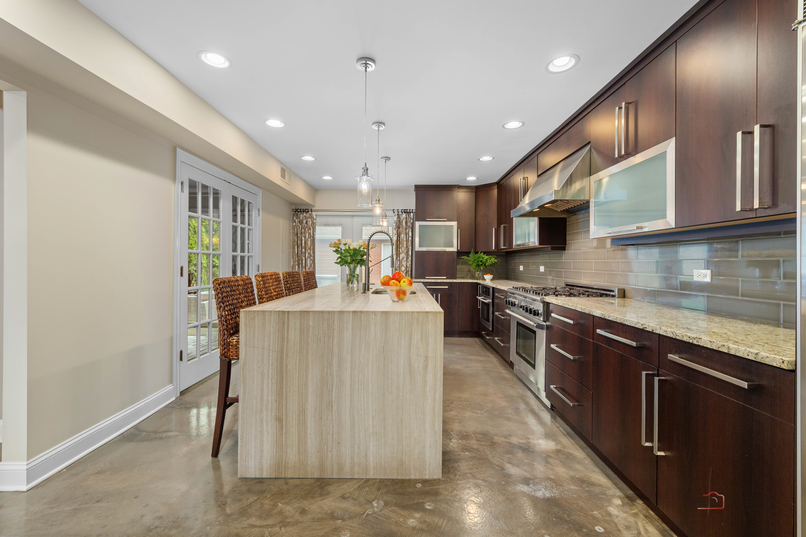 2 North Tower Road Oak Brook, IL 60523 - Photo 5 of 40 a kitchen with stainless steel appliances granite countertop lots of counter top space