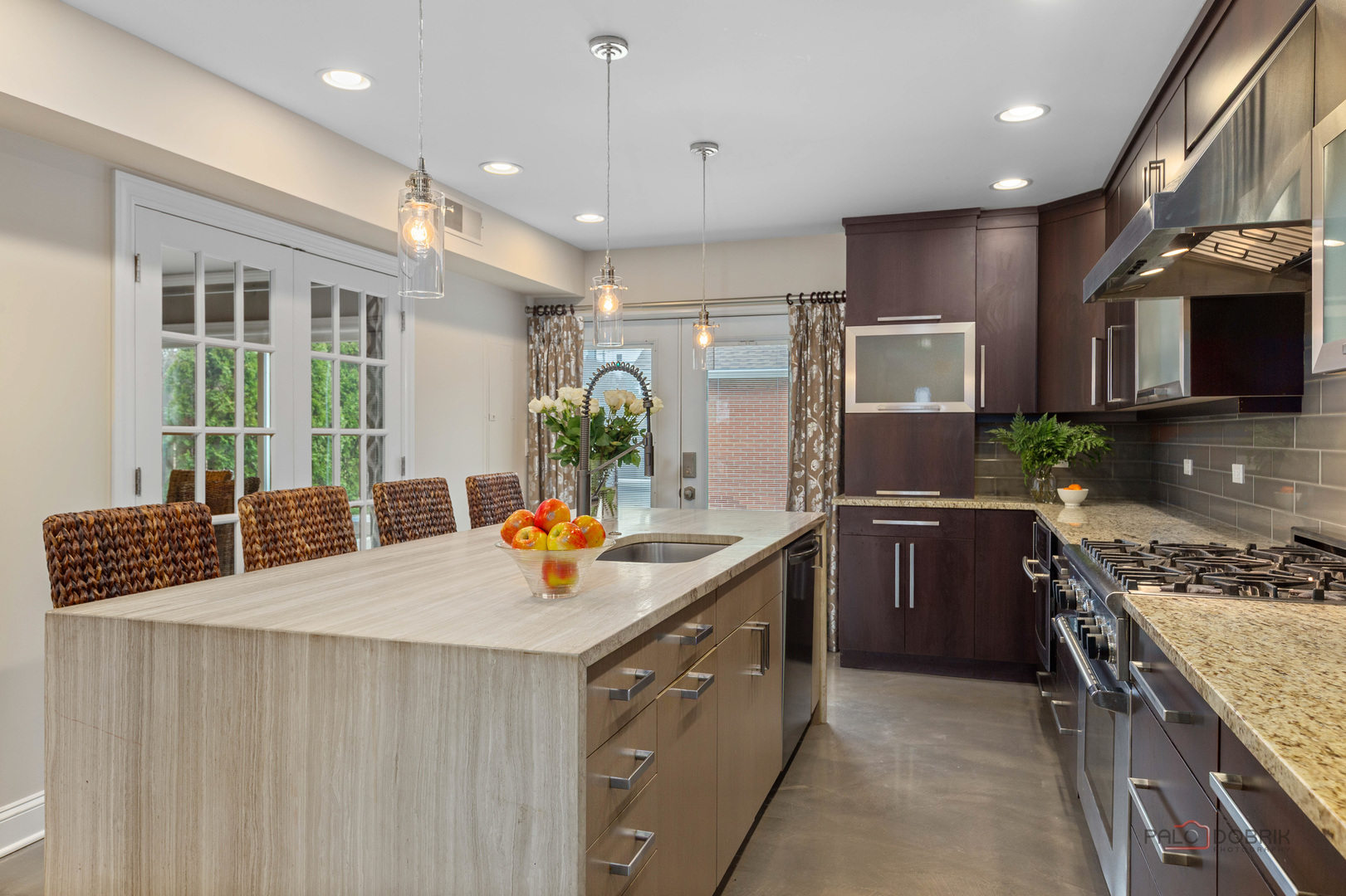 2 North Tower Road Oak Brook, IL 60523 - Photo 6 of 40 a kitchen with stainless steel appliances granite countertop a sink stove and refrigerator