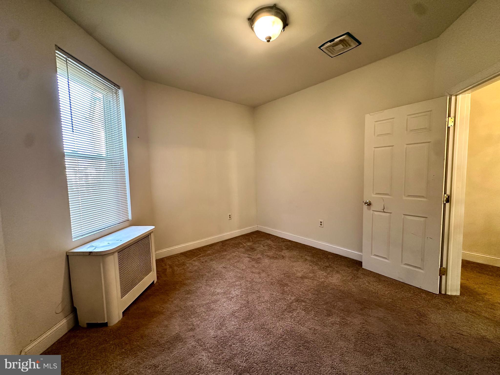 6209 Walnut Street Philadelphia, PA 19139 - Photo 11 of 13 an empty room with windows