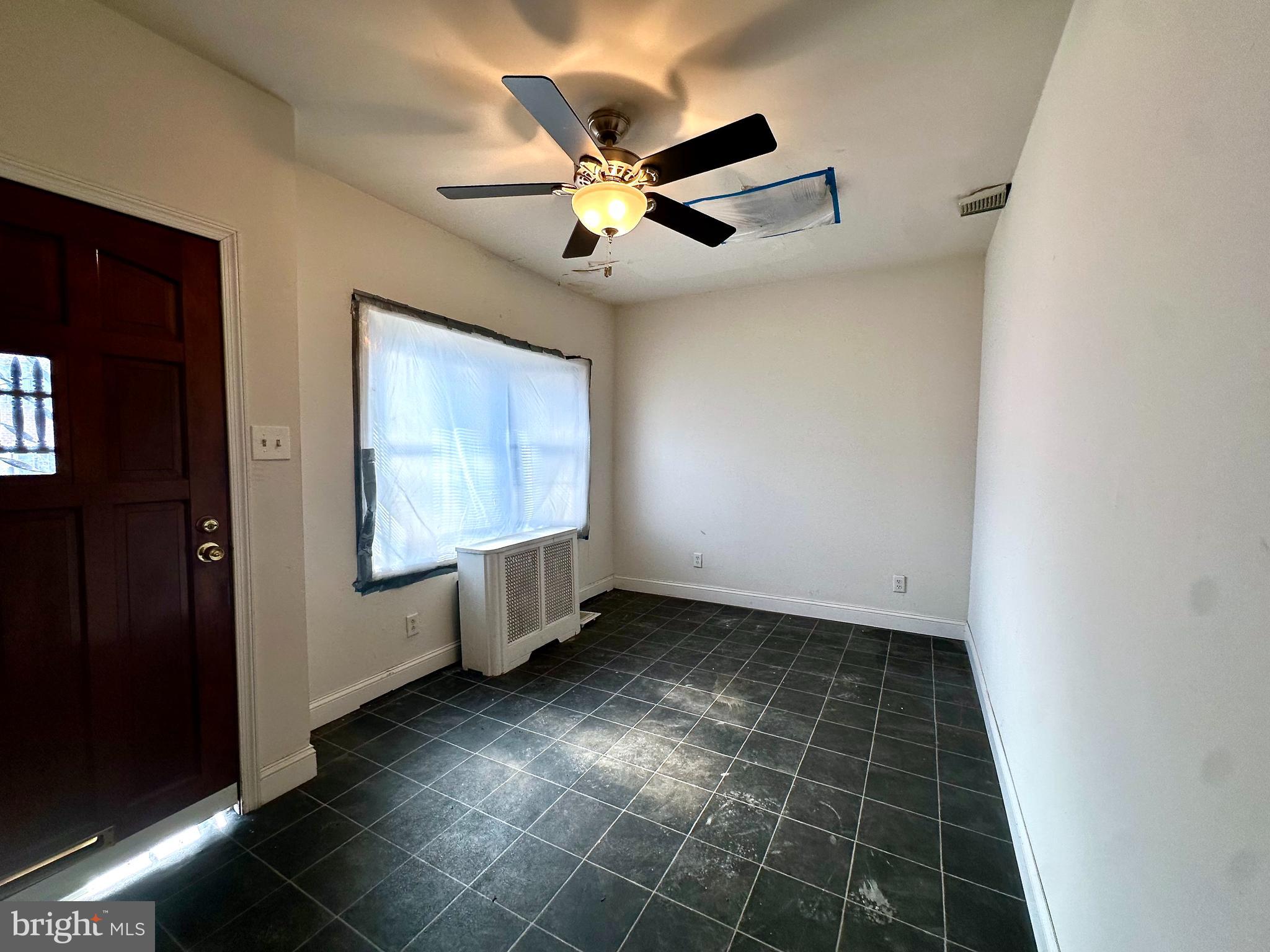 6209 Walnut Street Philadelphia, PA 19139 - Photo 2 of 13 a view of an empty room with a window