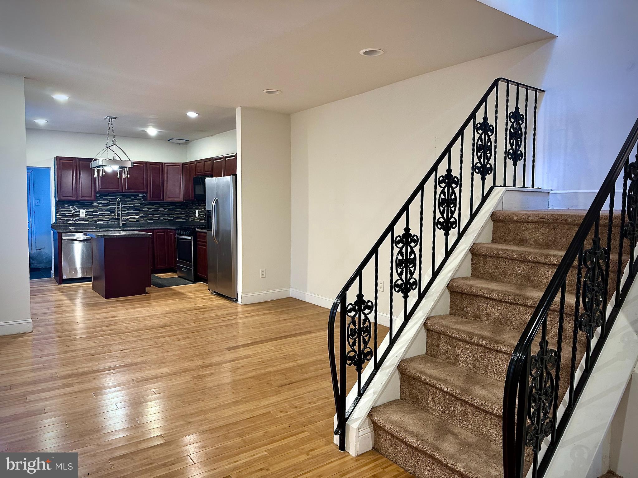 6209 Walnut Street Philadelphia, PA 19139 - Photo 3 of 13 a view of kitchen and kitchen with granite countertop wooden floor