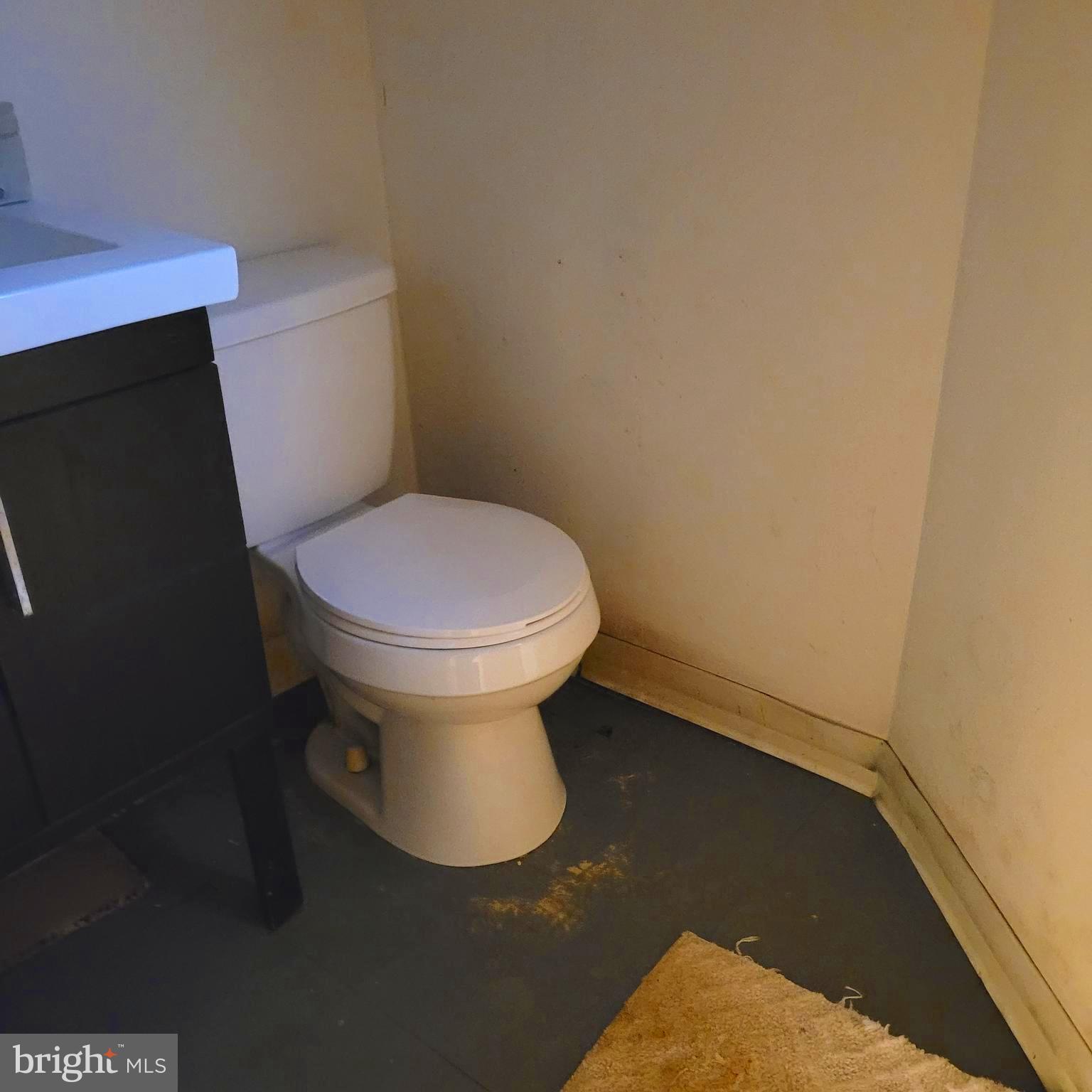 6209 Walnut Street Philadelphia, PA 19139 - Photo 7 of 13 a white toilet sitting next to a white wall
