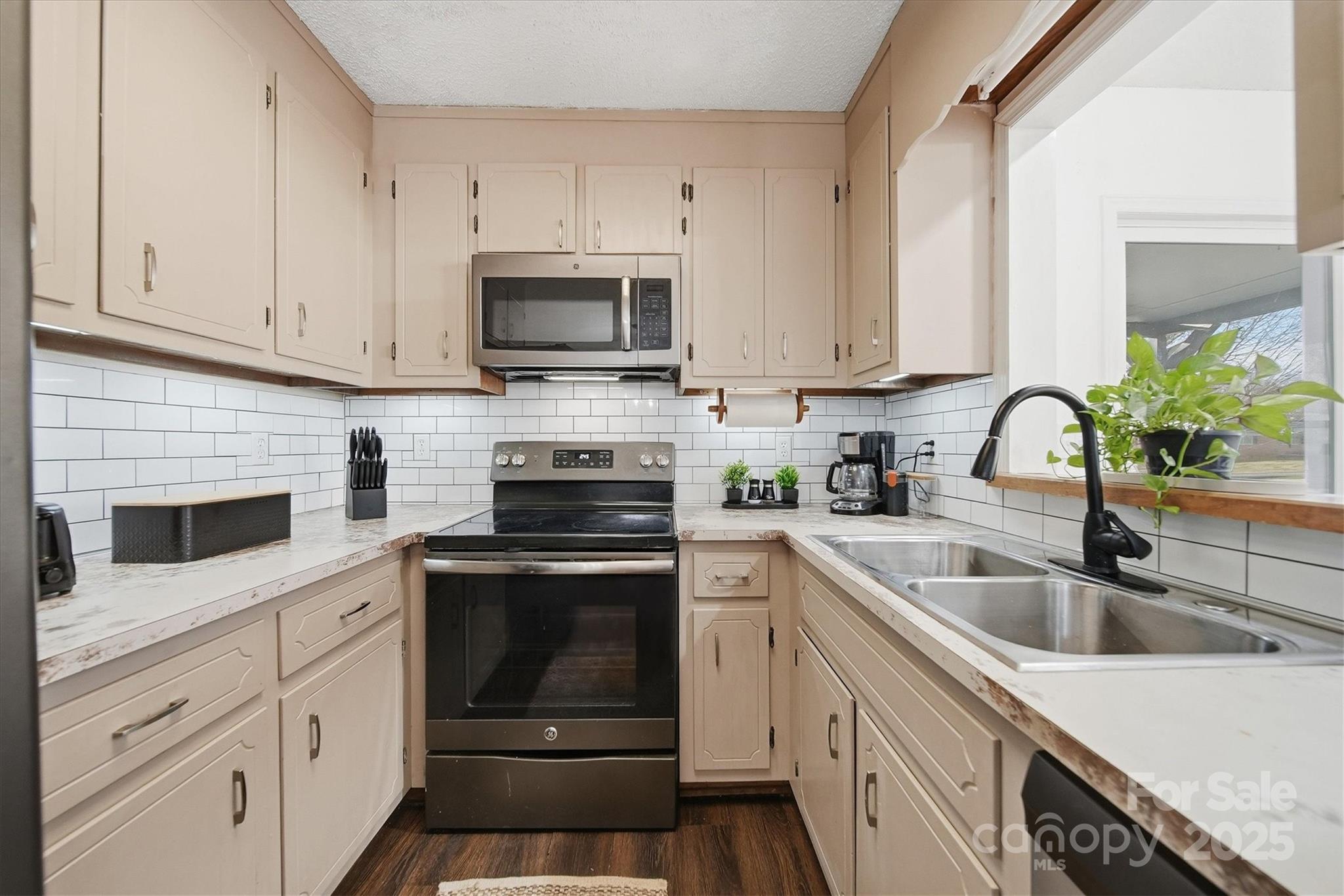 1007 Millbrook Place Southeast Lenoir, NC 28645 - Photo 13 of 46 a kitchen with appliances a sink and cabinets