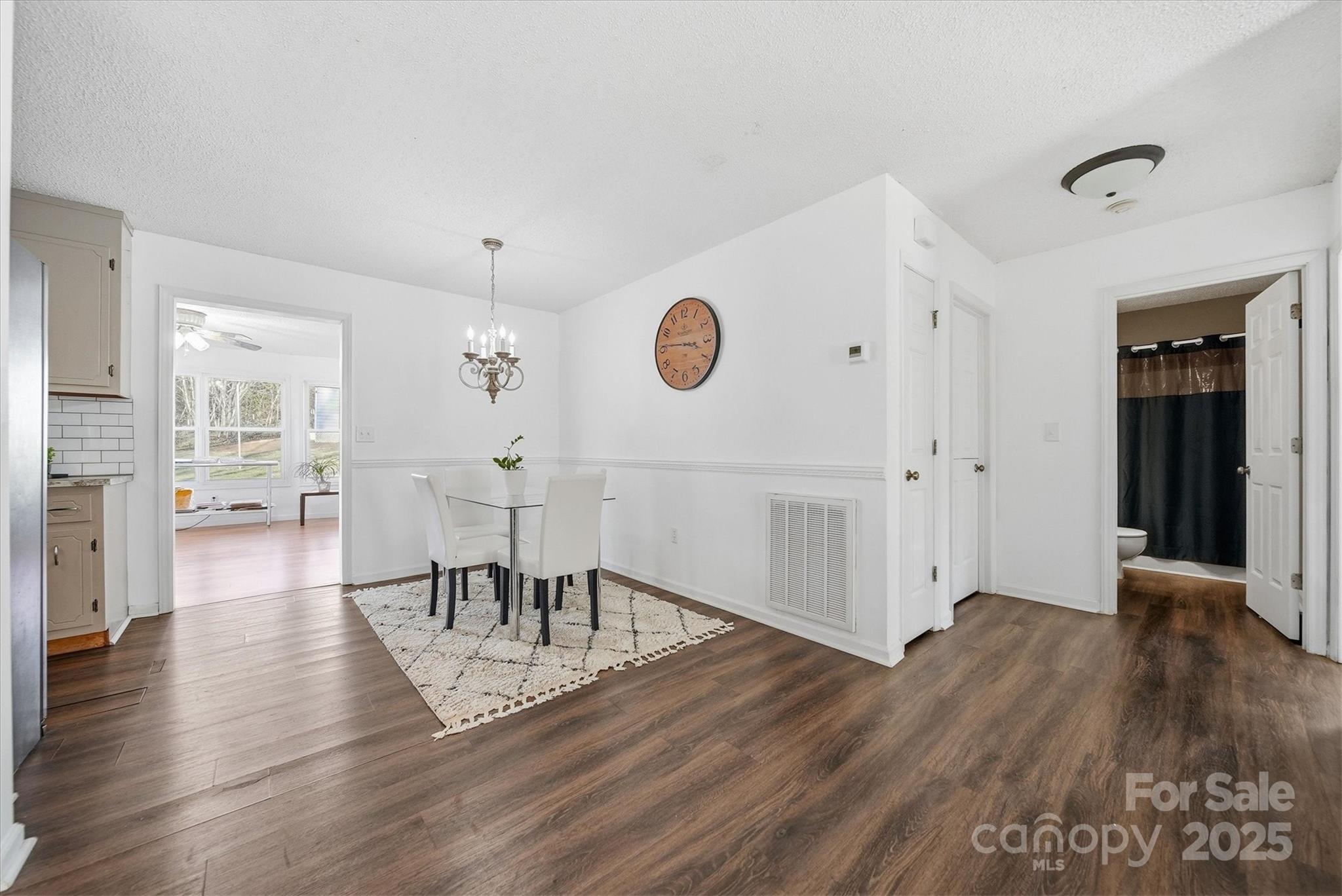 1007 Millbrook Place Southeast Lenoir, NC 28645 - Photo 17 of 46 a view of a dining room with wooden floor