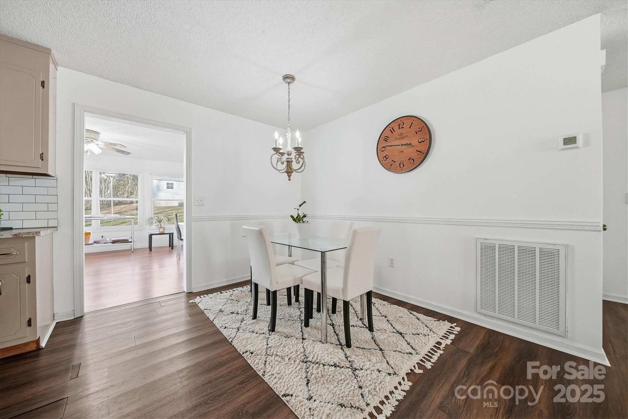 1007 Millbrook Place Southeast Lenoir, NC 28645 - Photo 18 of 46 a view of a dining room with furniture and wooden floor