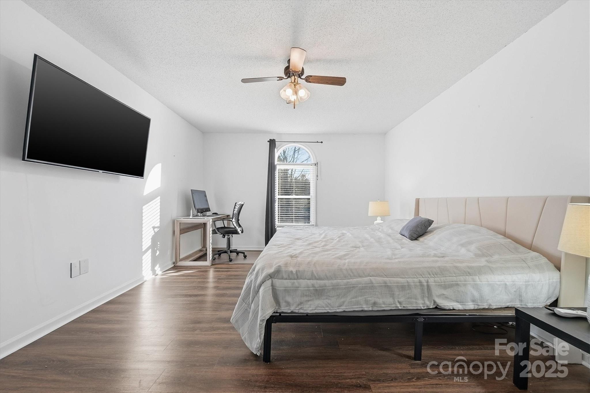 1007 Millbrook Place Southeast Lenoir, NC 28645 - Photo 24 of 46 a bedroom with a bed and a flat screen tv