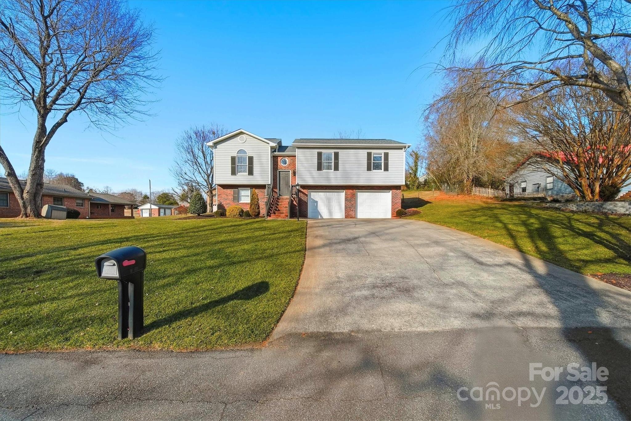 1007 Millbrook Place Southeast Lenoir, NC 28645 - Photo 38 of 46 a front view of a house with a yard
