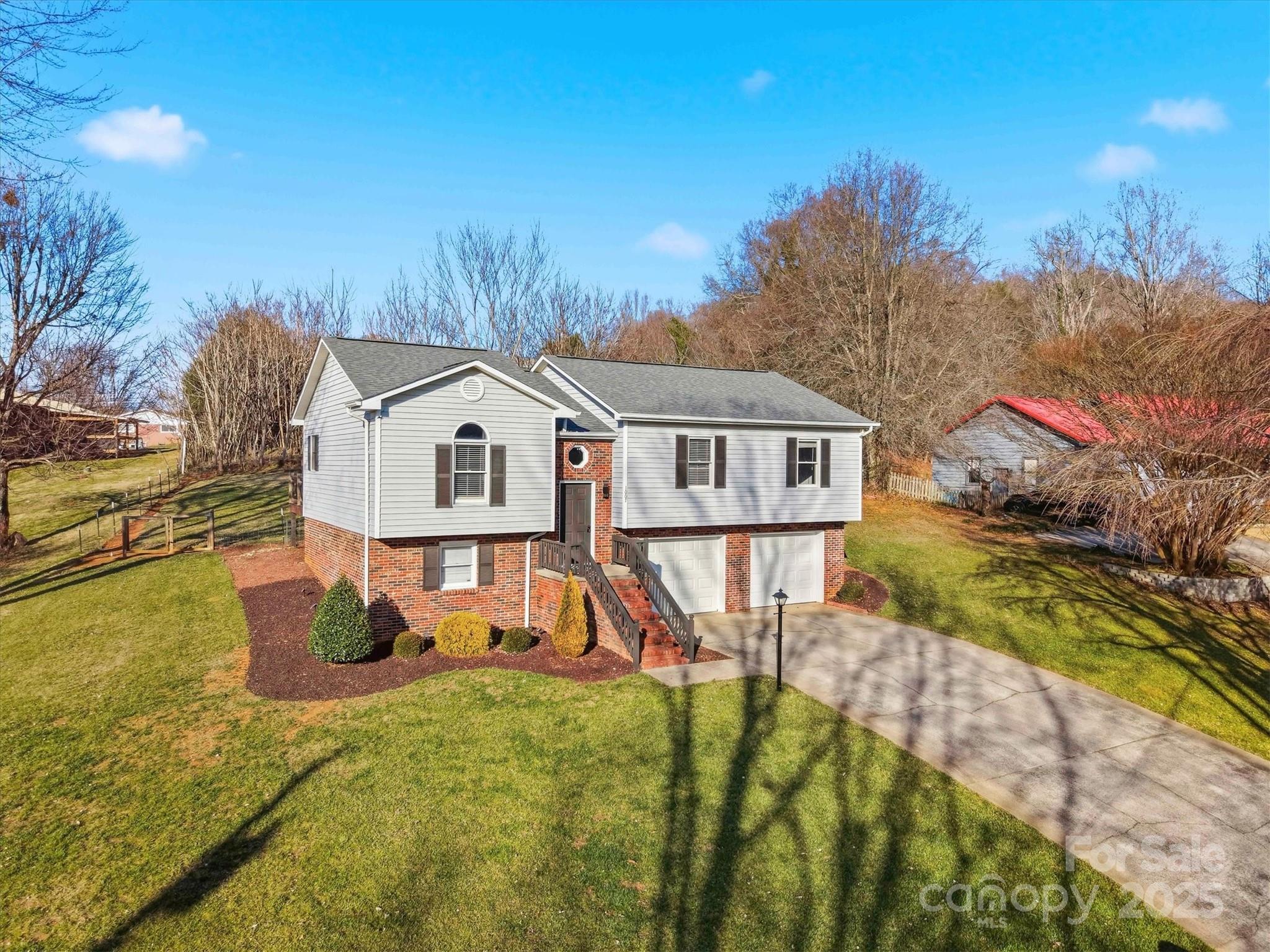 1007 Millbrook Place Southeast Lenoir, NC 28645 - Photo 43 of 46 a view of a house with backyard and sitting area