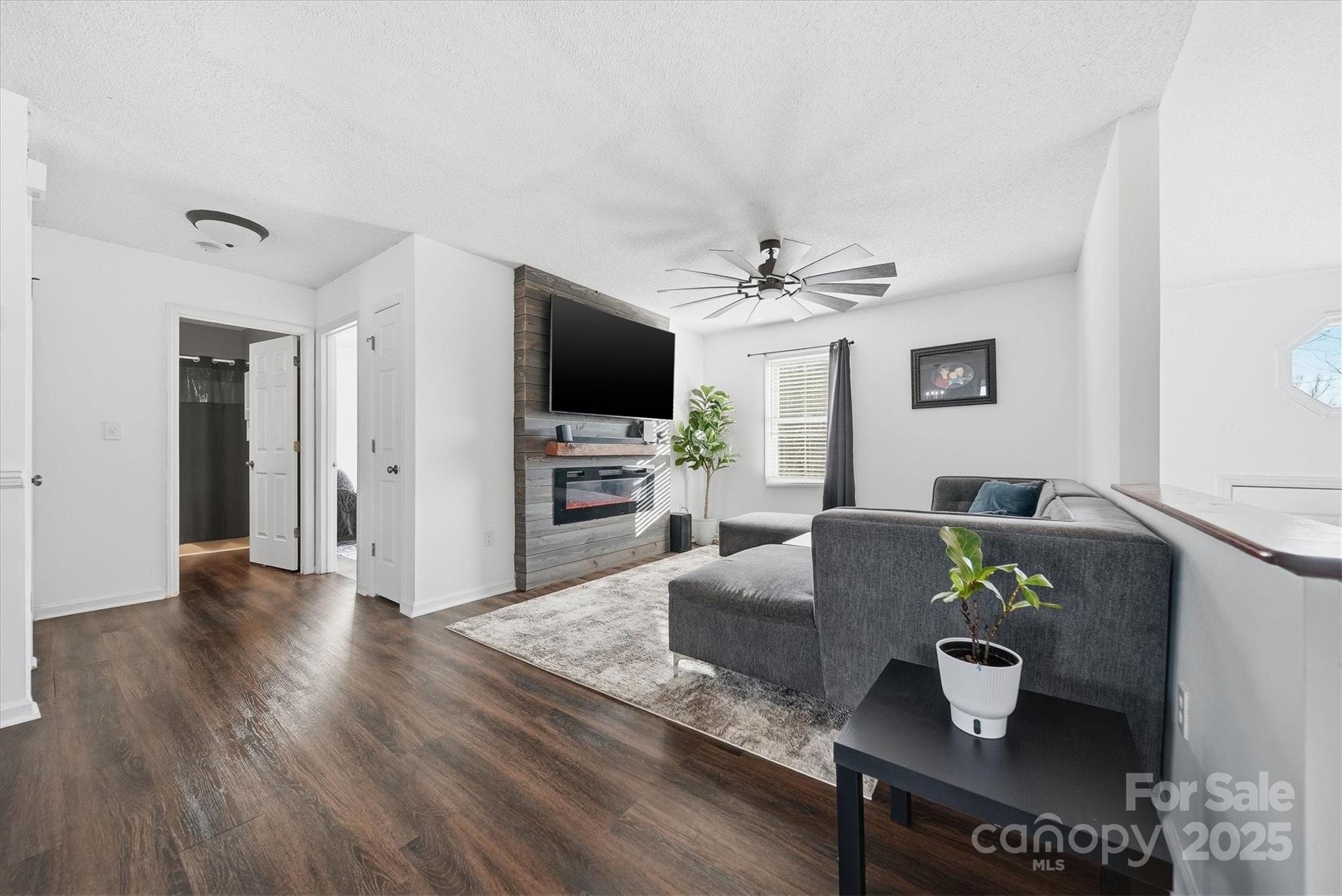 1007 Millbrook Place Southeast Lenoir, NC 28645 - Photo 5 of 46 a living room with furniture and a flat screen tv