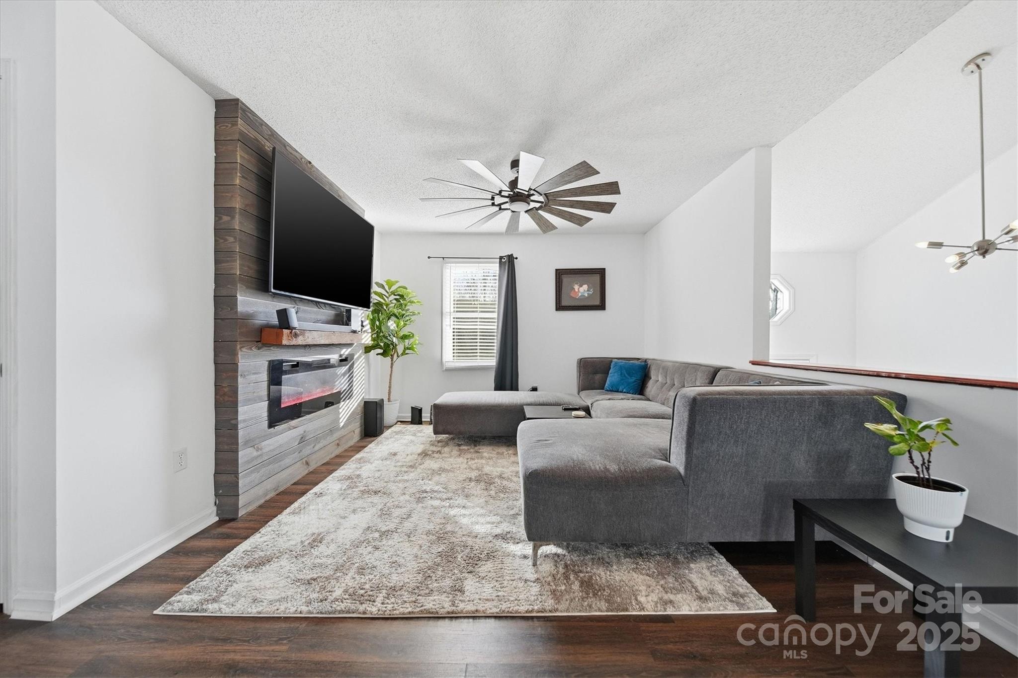 1007 Millbrook Place Southeast Lenoir, NC 28645 - Photo 6 of 46 a living room with furniture and a flat screen tv