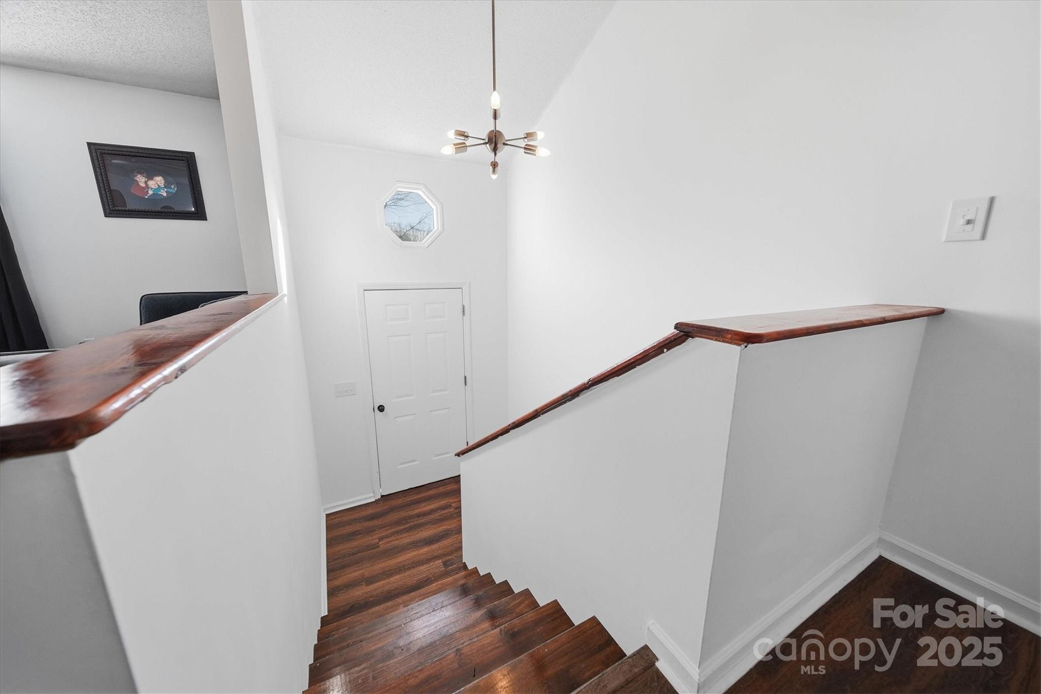 1007 Millbrook Place Southeast Lenoir, NC 28645 - Photo 9 of 46 a view of entryway with stairs and wooden floor
