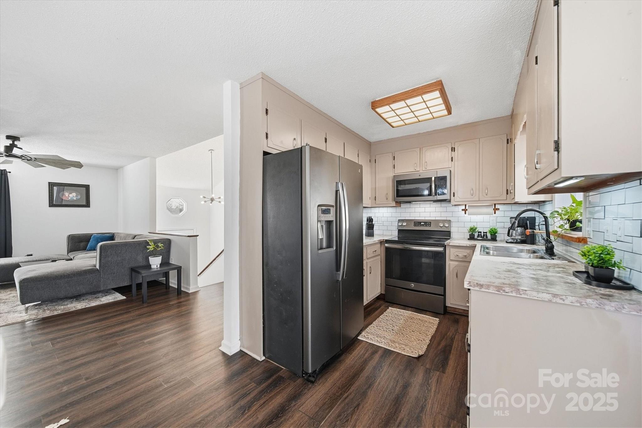 1007 Millbrook Place Southeast Lenoir, NC 28645 - Photo 10 of 46 a kitchen with stainless steel appliances a refrigerator sink and cabinets