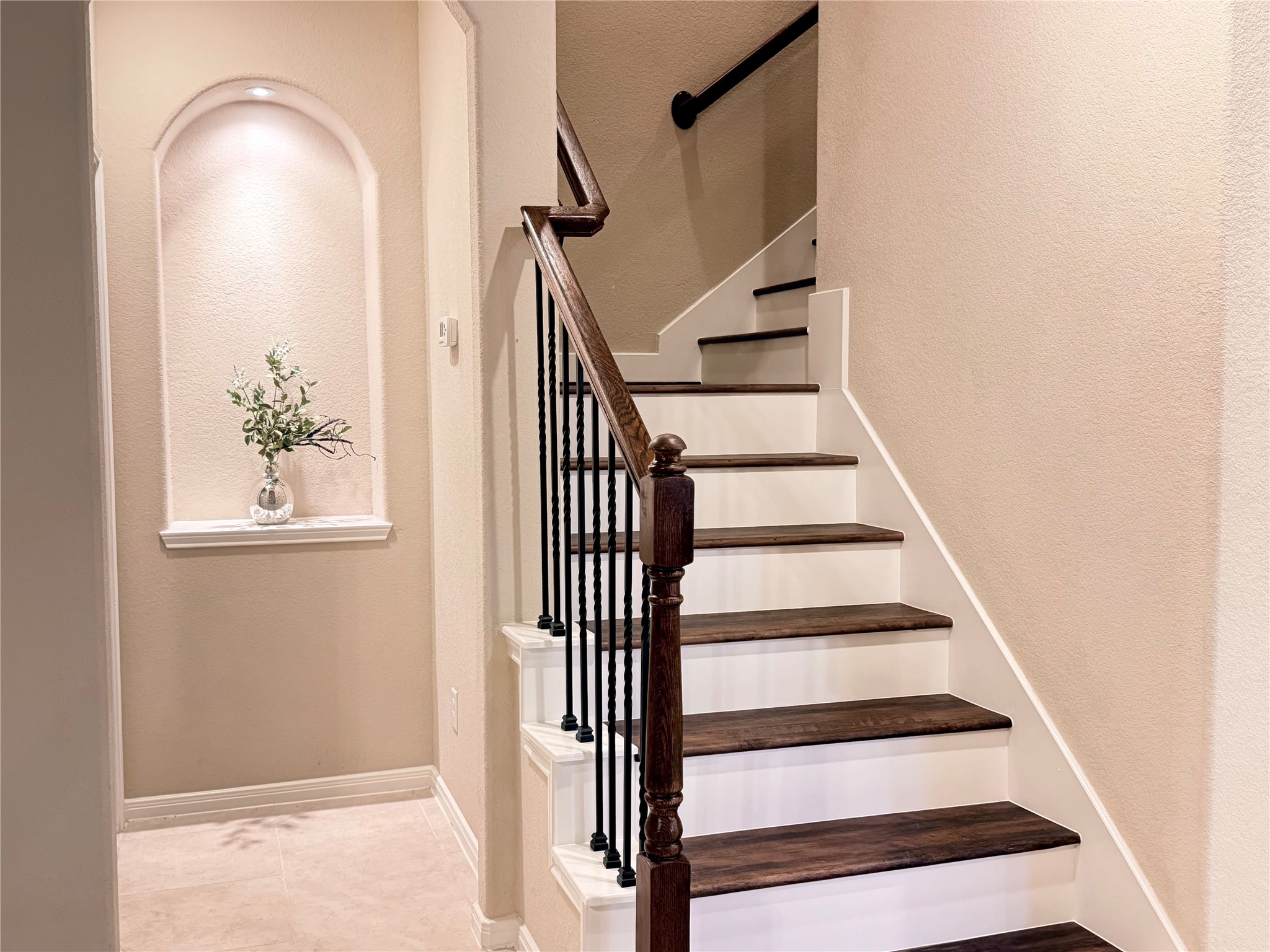 5502 Claymore Meadow Lane Spring, TX 77389 - Photo 19 of 45 Beautiful new wood looking floor staircase and iron handrails.